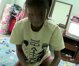 Thai woman in her apartment with milky boyfriend