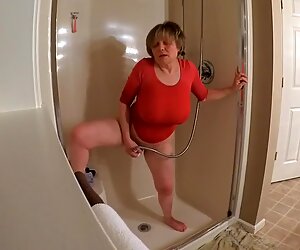 60 Plus GILF gets off in wet t-shirt